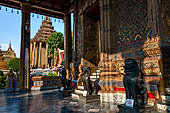 Bangkok Grand Palace,  Wat Phra Keow (temple of the Emerald Buddha). Bronze lion (singha)  statues in Khmer style guard the western entrance of the Ubosot.  